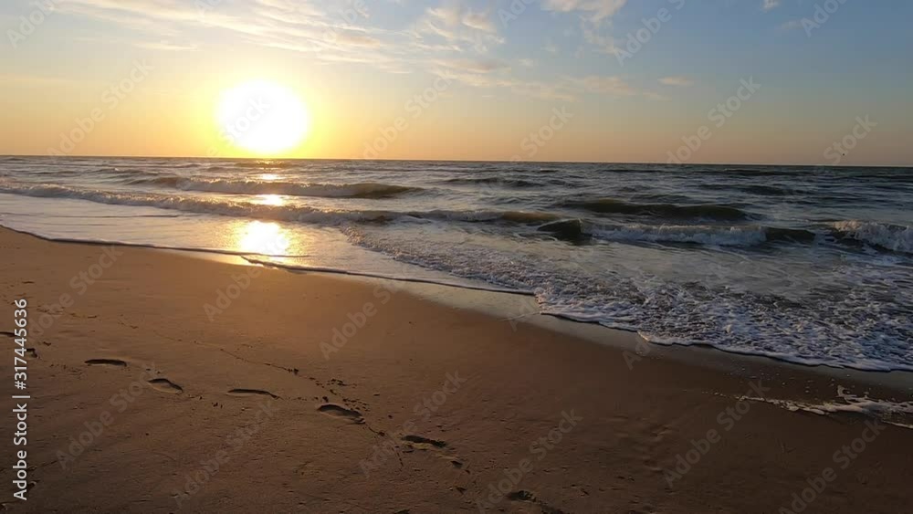 Sunset sunrise dawning at sea ocean. Water and waves sea landscape Sunset sunrise dawning at sea ocean. Water and waves sea landscape