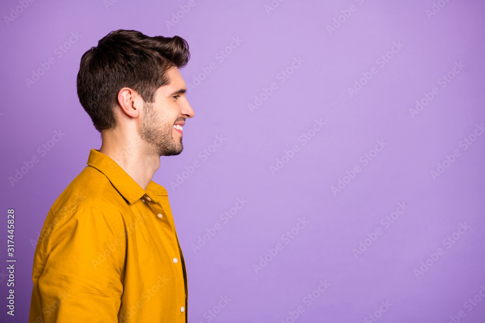 Photo of cheerful confident man with perfect posture looking into empty space with face unshaven isolated violet pastel color background Photo of cheerful confident man with perfect posture looking into empty space with face unshaven isolated violet pastel color background