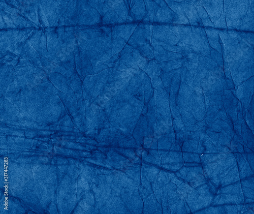 Crumbled Textured Paper toned in trendy Classic Blue color of the Year 2020