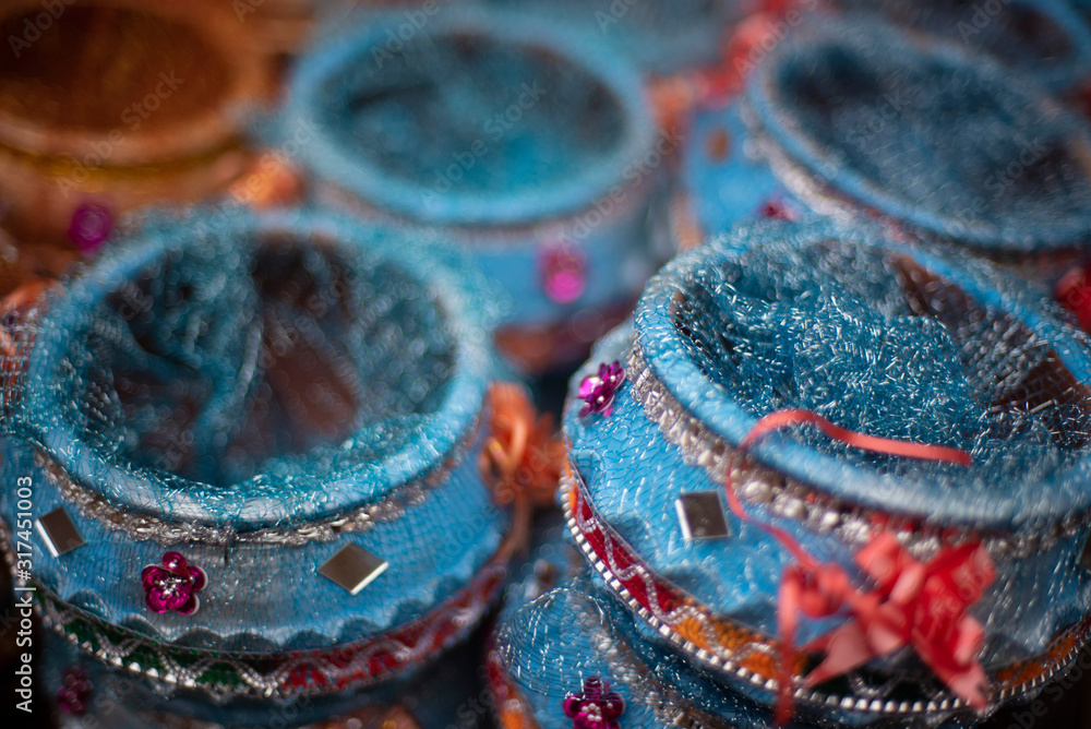 Blue decorative earthen pots are displayed in a local street shop for sale. Indian market and handicraft. Blue decorative earthen pots are displayed in a local street shop for sale. Indian market and handicraft.