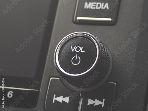 Volume and power button on car stereo entertainment system