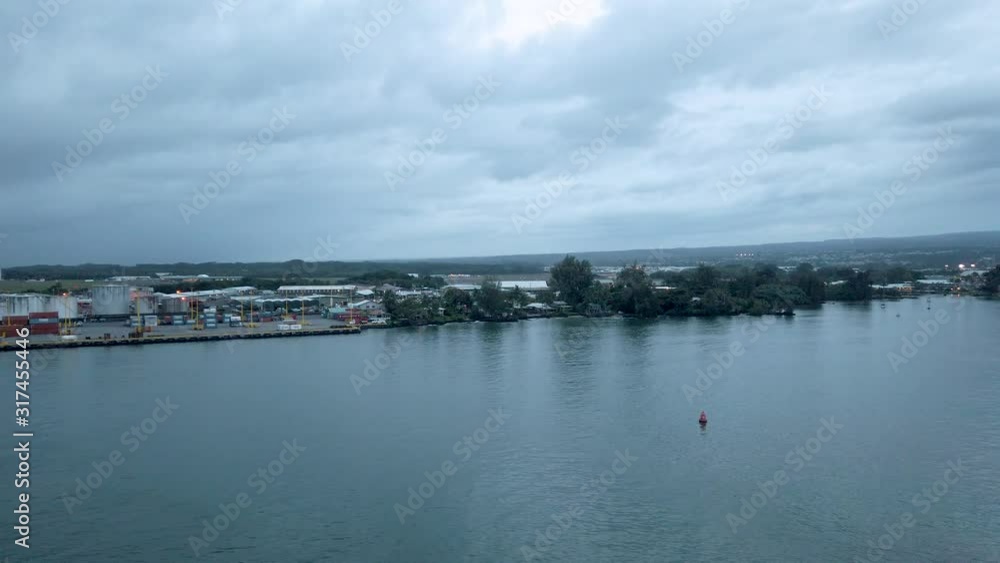 Cityscape from cruise ship in Hilo on the Big Island of Hawaii. On the east side of the Big Island of Hawaii, is a crescent-shaped bay along which the small town of Hilo is nestled. Cityscape from cruise ship in Hilo on the Big Island of Hawaii. On the east side of the Big Island of Hawaii, is a crescent-shaped bay along which the small town of Hilo is nestled.