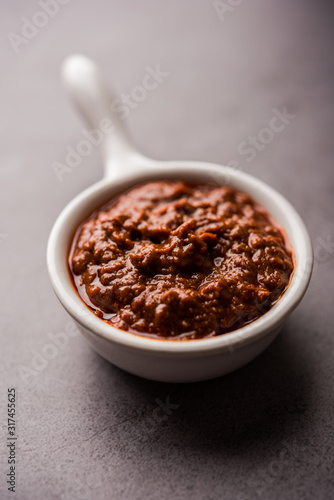 Homemade Tandoori Paste or Marinade mixture, in a bowl. used for grilled chicken or Paneer or vegetable. selective focus