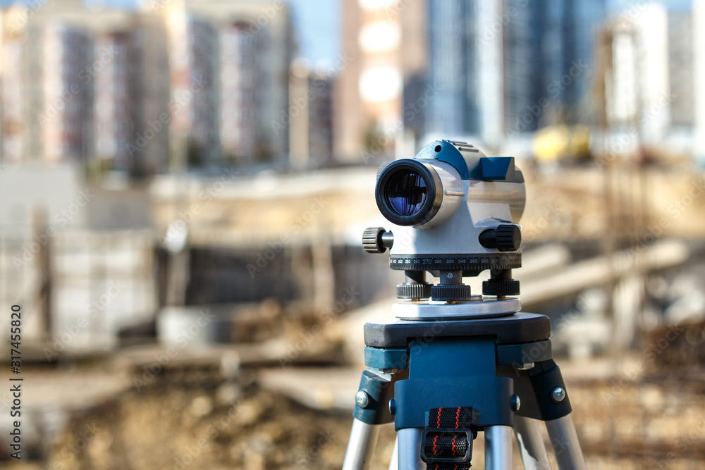 Naklejka premium Surveyor equipment GPS system or theodolite outdoors at highway construction site.Measuring instrument close-up. Surveyor engineering with total station