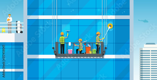 Workers are cleaning the glass building by a safe crane.
