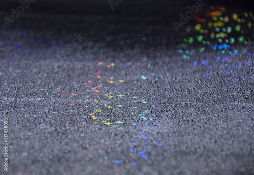 Abstract multicolor glitter background stock images. Wallpaper with rainbow glitter effect background. Festive background with shiny colored stars. Backdrop with water drops stock images