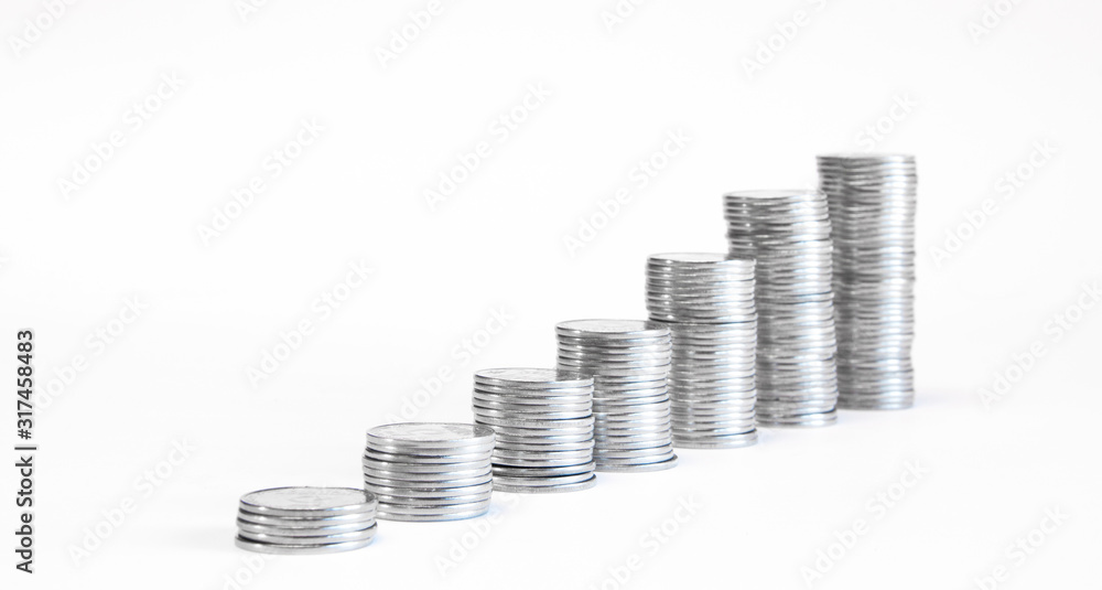 A stack of coins in ascending order. Profit growth concept. The economic growth. On white... A stack of coins in ascending order. Profit growth concept. The economic growth. On white...