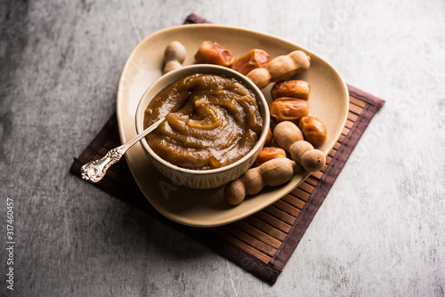 Dates Tamarind Chutney - Khajoor crushed to paste and mixed with Imli or imalee paste, served as a side dish in India photo