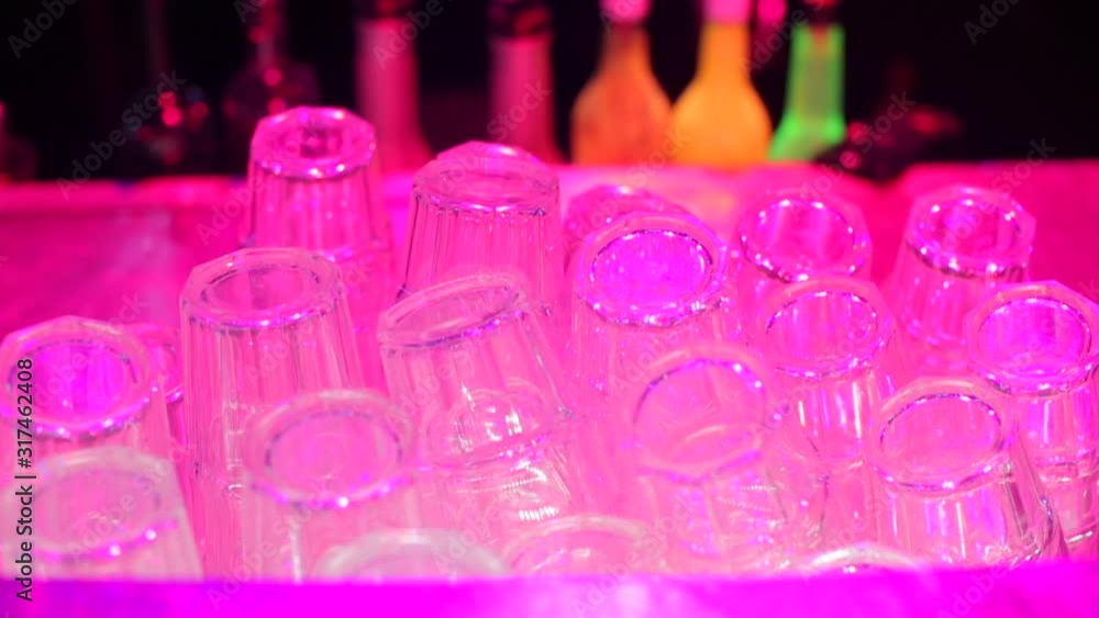 Close-up of folded glasses in a bar at a nightclub party. Close-up of folded glasses in a bar at a nightclub party.