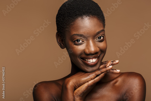 Beauty portrait of young half-naked african woman with short black hair