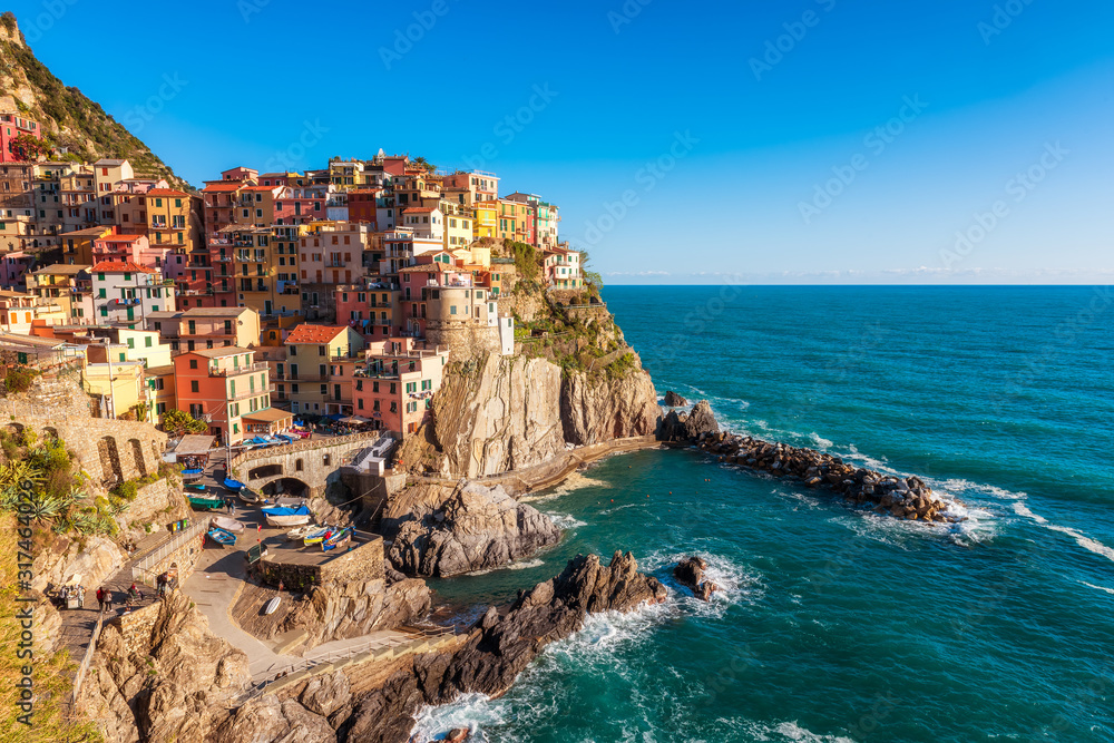 Panoramic view of beautiful town of Manarola - one of five famous colorful villages of Cinque Terre National Park in Italy, Liguria region.