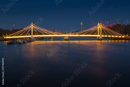 Long exposure  illuminated Albert bridge in London
