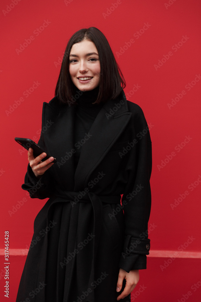 Beautiful young brunette woman wearing autumn coat Beautiful young brunette woman wearing autumn coat