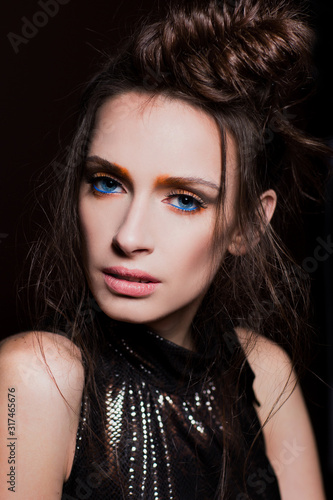 Wallpaper Mural Beautiful sexy woman with bright fashion makeup and fashionable shining hairstyle in black dress in studio on black background. High fashion portrait. Vogue style Torontodigital.ca