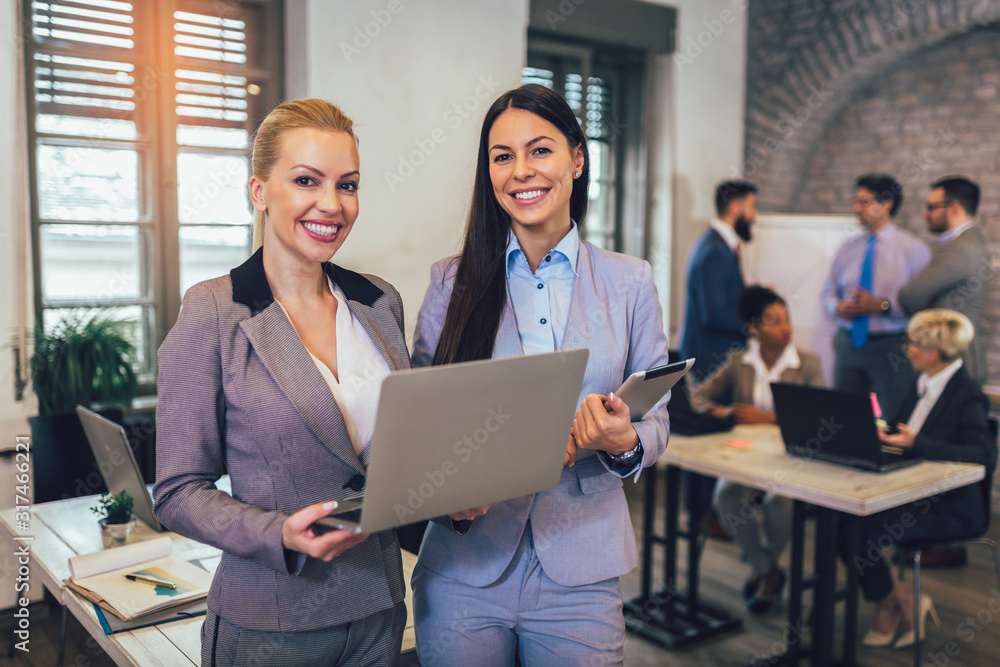 Business women with her staff, people group in background at modern office. Business women with her staff, people group in background at modern office.