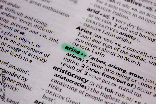 Fototapet Arise word or phrase in a dictionary.