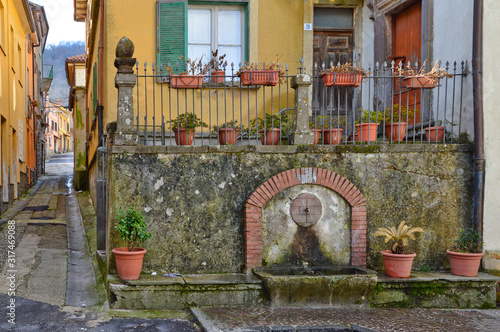 Roccamonfina, Italy, 02/11/2017. An old fountain in a mountain village photo