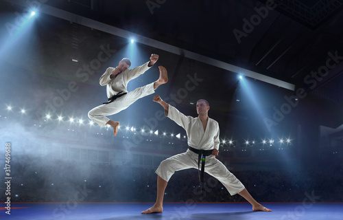 Karate fighters on tatami. Fighting Championship. © Victoria VIAR PRO