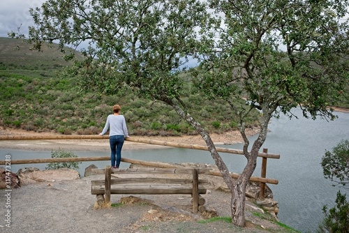 A woman contemplates the meander of the Tagus river in Spain