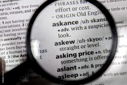 фотографія The word or phrase askew in a dictionary.