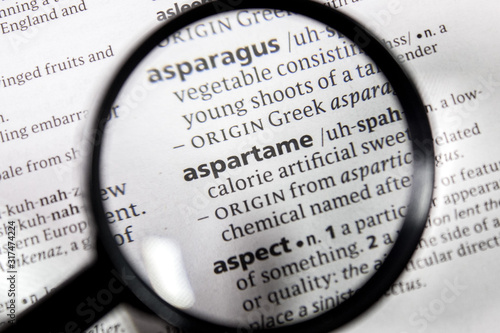 The word or phrase aspartame in a dictionary. photo