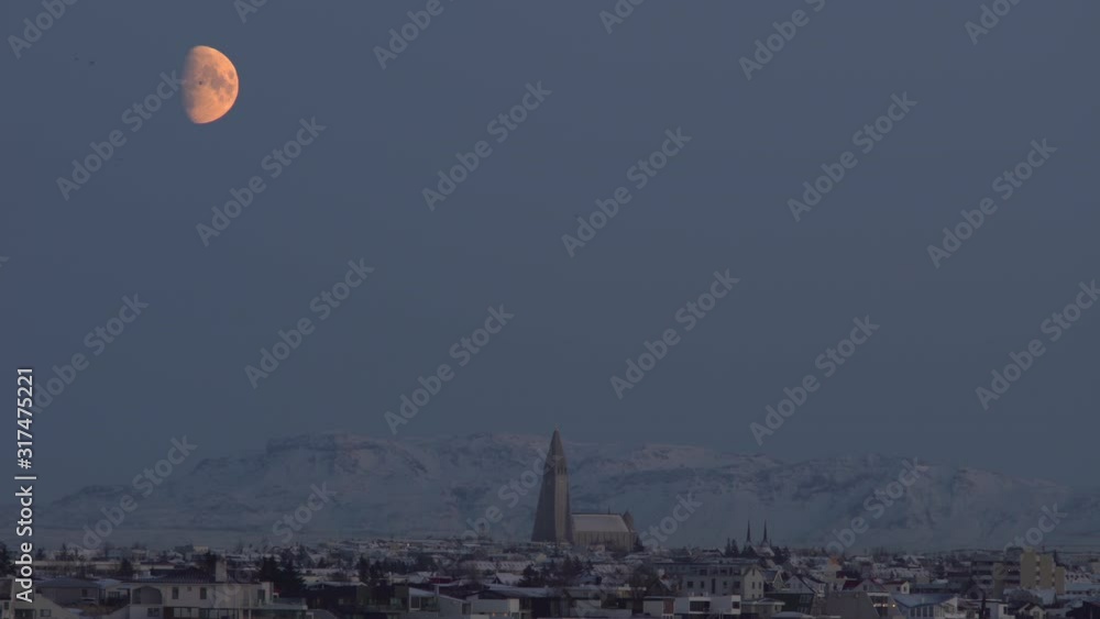 Birds flying in front of detailed moon Reykjavik Iceland winter dusk.mov Birds flying in front of detailed moon Reykjavik Iceland winter dusk.mov