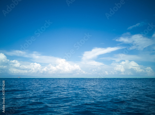 Blue sea under a beutiful sky. Dark blue and turquoise in Semporna Islands, Borneo, Sabah. photo