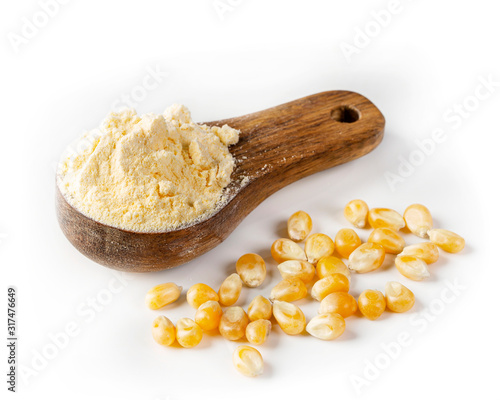 Foto Corn flour in a wooden spoon