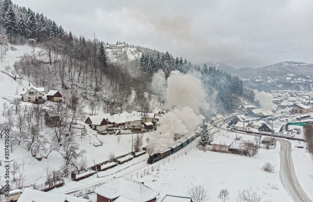 Fototapeta premium Winter Steam Train Narrow Gauge Mocanita Romania