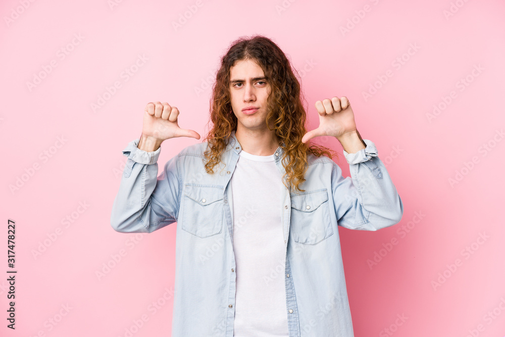 Long hair man posing isolated feels proud and self confident, example to follow. Long hair man posing isolated feels proud and self confident, example to follow.