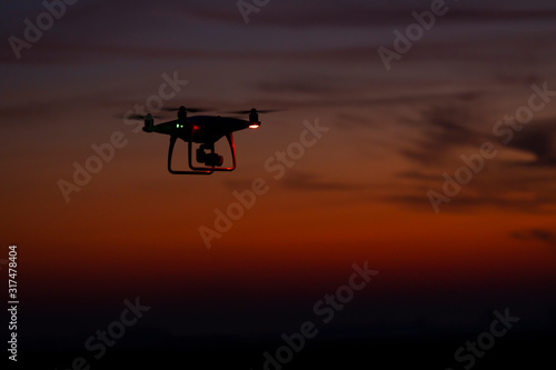 Drone in flight at sunset