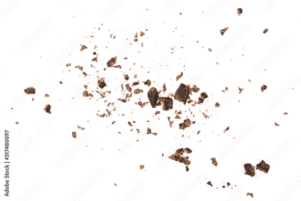 Chocolate shavings and chunks pile isolated on white background, top view