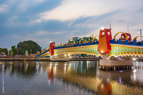 A photo of Brendeng Bridge (Jembatan Brendeng) across Cisadane River in Tangerang, Banten; at sunset. photo