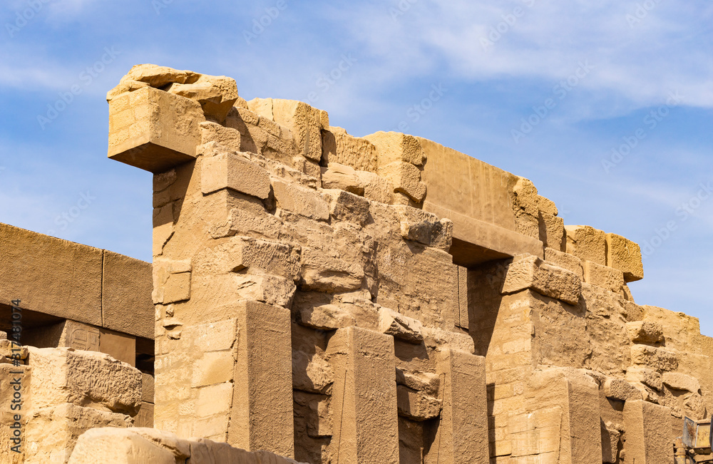 Karnak Temple, complex of Amun-Re. Great Hypostyle Hall. Embossed hieroglyphics on columns. Luxor Governorate, Egypt.