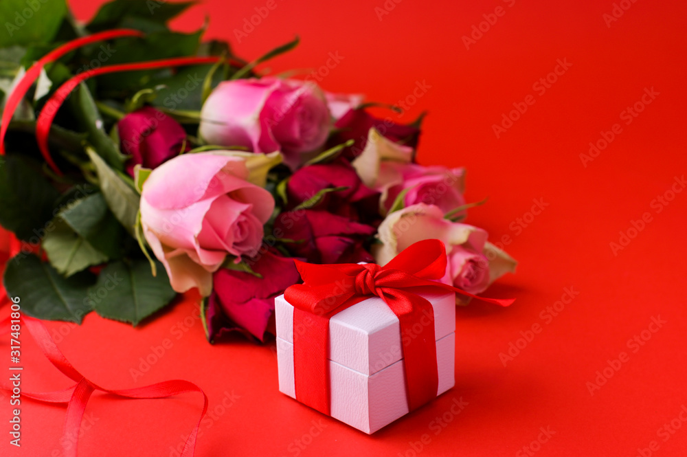 Women's day concept and Valentine's day greeting card. Composition with gift, roses. Space for text. Women's day concept and Valentine's day greeting card. Composition with gift, roses. Space for text.