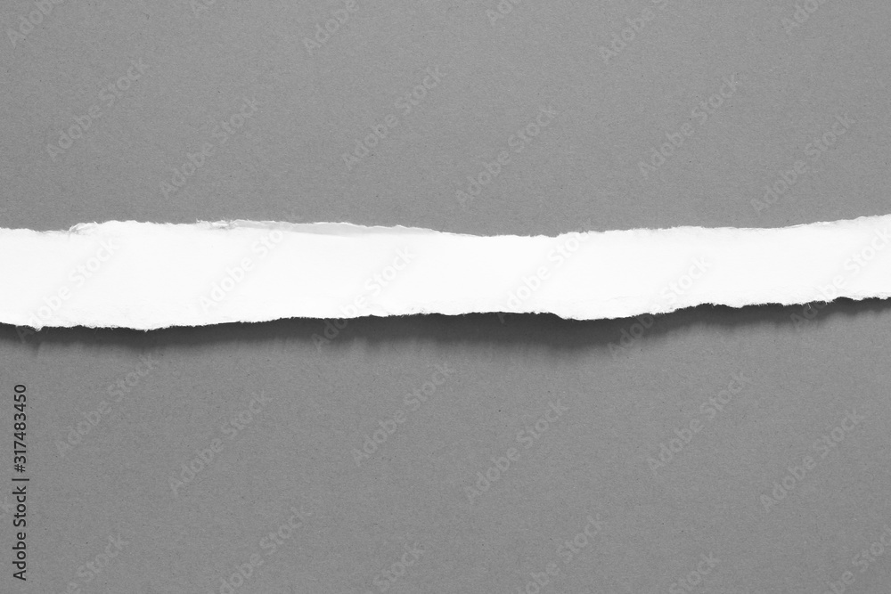 old torn paper on gray background with copy space for text old torn paper on gray background with copy space for text