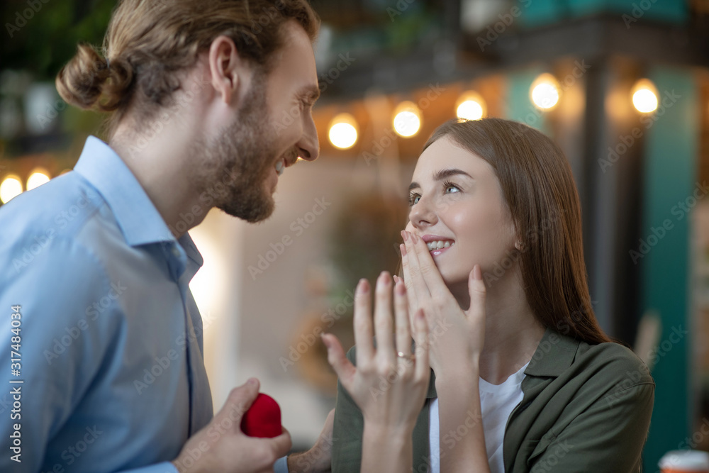 Woman reacting emotionaly to the receiving a proposal Woman reacting emotionaly to the receiving a proposal