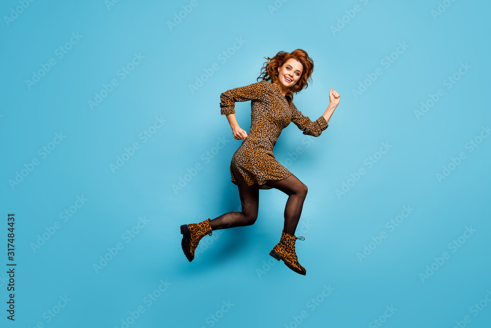 Full size profile photo of funny lady jump up high speed rushing autumn season discounts wear classy short leopard pattern dress footwear isolated blue color background