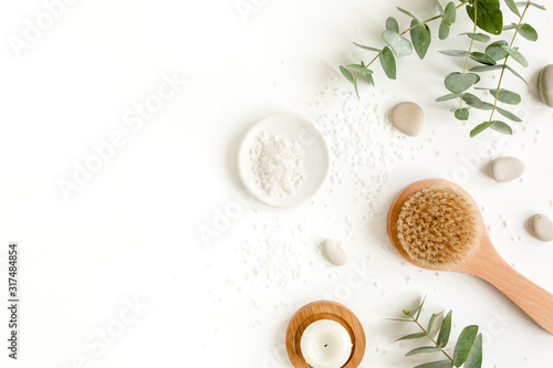 Spa Background. Natural/Organic spa cosmetics products, eco friendly bathroom accessories, eucalyptus leaves. Skincare concept on white background. Flat lay, top view