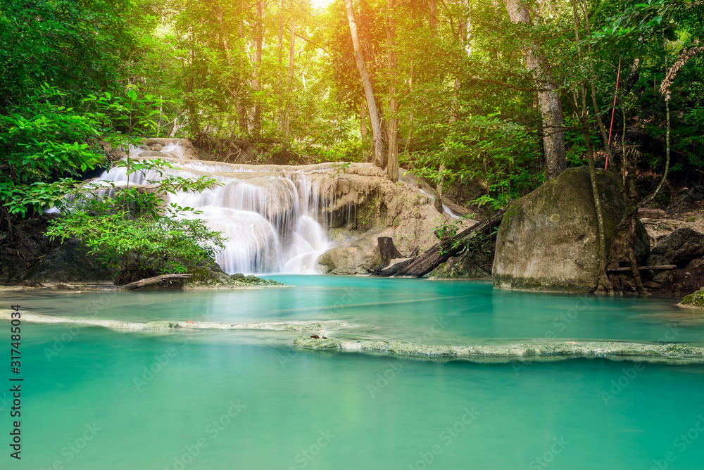 Naklejka premium Waterfall in Tropical forest at Erawan waterfall National Park, Thailand 