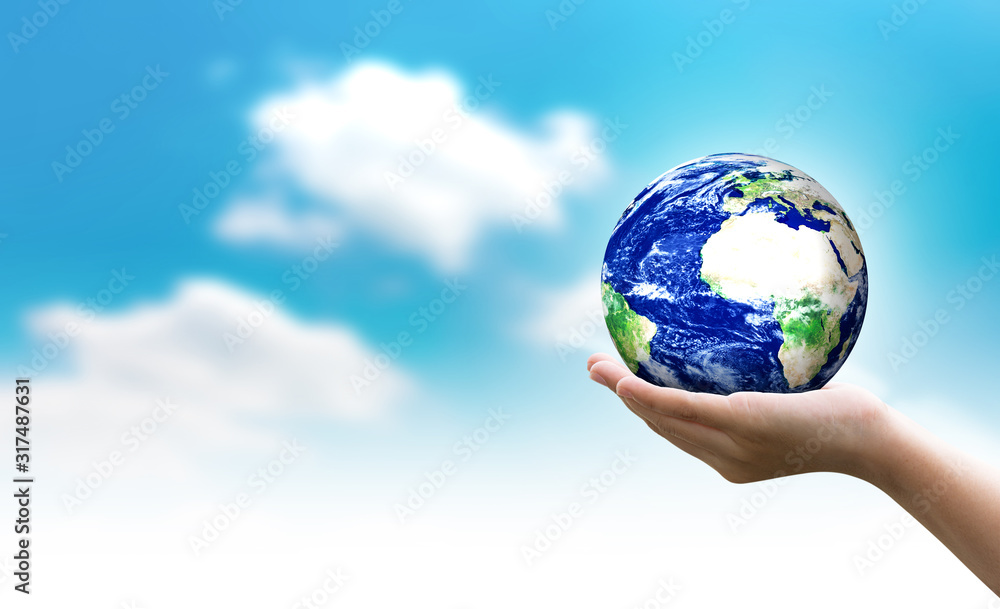 Woman hands holding world or globe on earth day.Environment conservation and energy saving concept.Elements of this image are furnished by NASA. Woman hands holding world or globe on earth day.Environment conservation and energy saving concept.Elements of this image are furnished by NASA.