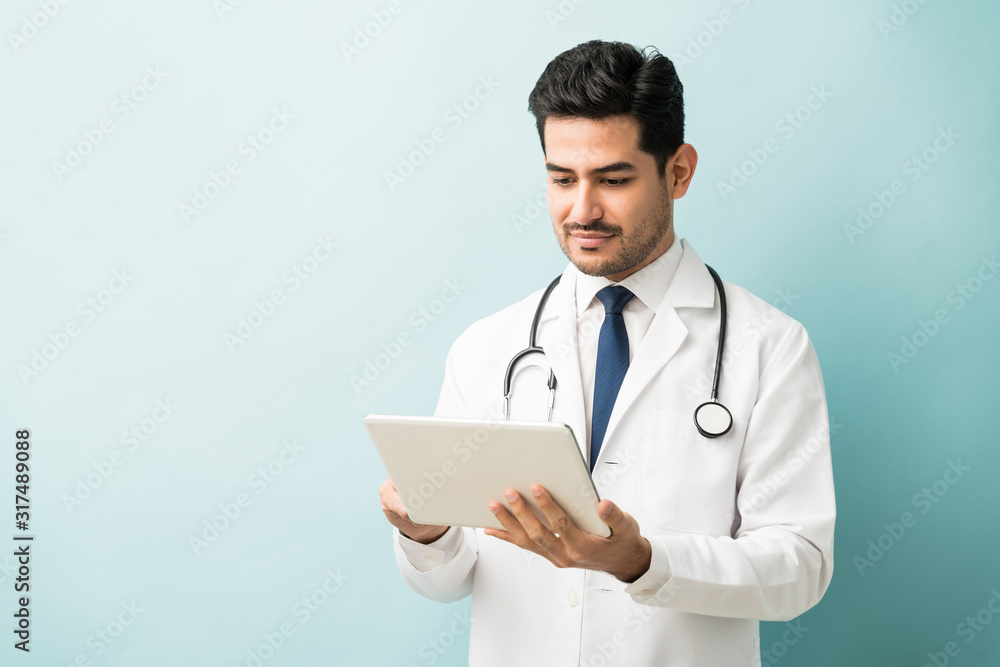 Medical Professional Using Wireless Computer In Studio Medical Professional Using Wireless Computer In Studio
