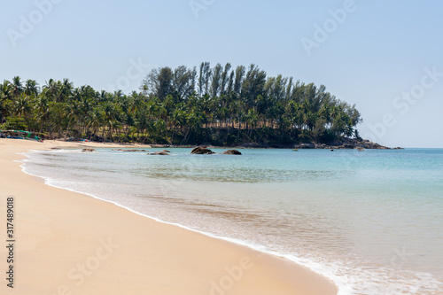 Beautiful sand beach with trees in the background at Khao Pilai Beach Thailand.