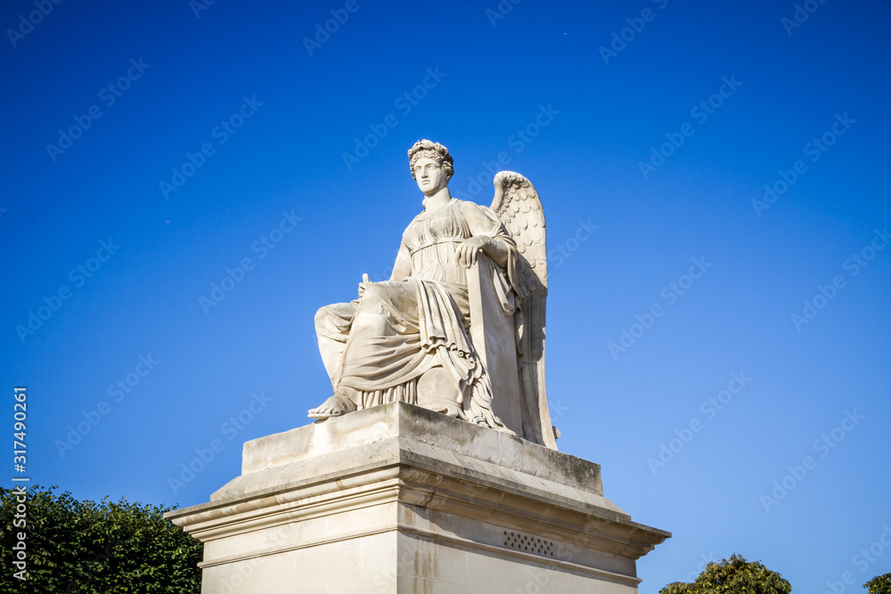 History statue near the Triumphal Arch of the Carrousel, Paris, France