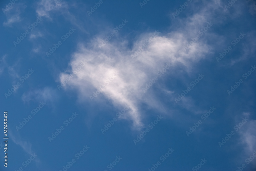 A cloud in a shape of heart in the blue sky, love nature, Valentines day