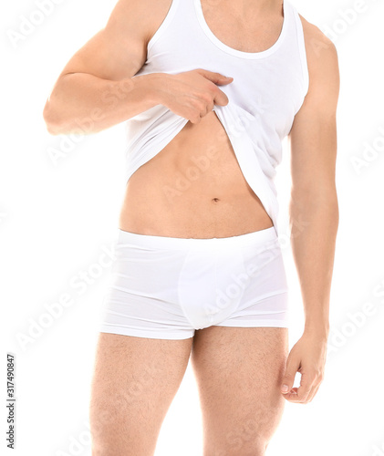 Handsome man in underwear on white background