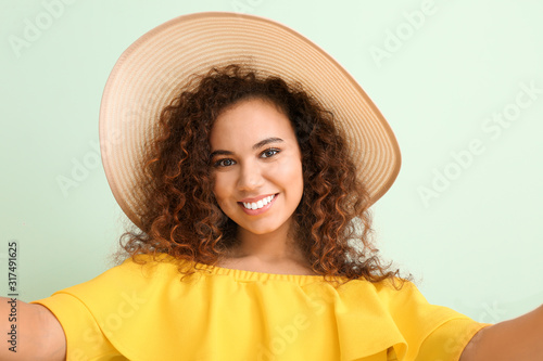 Beautiful young woman takin...