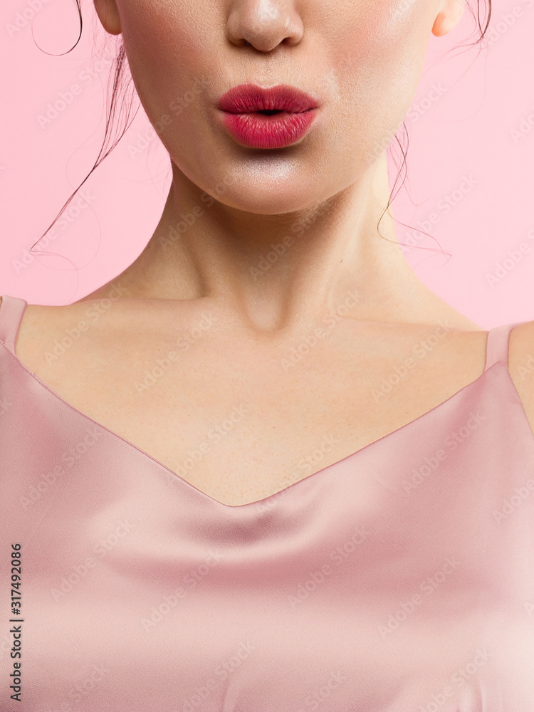 Close-up perfect lip makeup beautiful female mouth. Plump sexy full lips. Macro photo face detail. Perfect clean skin, fresh lip make-up. Sweet pink lipstick, magenta color. Valentine's day style Close-up perfect lip makeup beautiful female mouth. Plump sexy full lips. Macro photo face detail. Perfect clean skin, fresh lip make-up. Sweet pink lipstick, magenta color. Valentine's day style