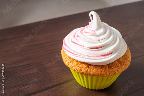 Vanilla cupcake, with a protein cream in the form, stained with red currant juice.