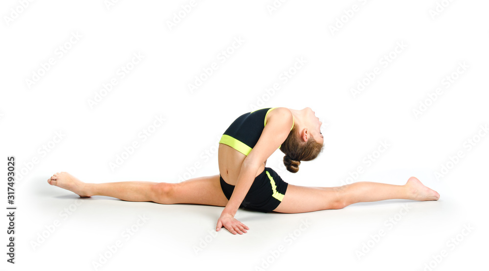Flexible cute little girl child gymnast doing acrobatic exercise isolated on a white background Flexible cute little girl child gymnast doing acrobatic exercise isolated on a white background
